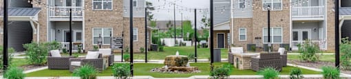 a courtyard with a fountain in the middle of an apartment complex