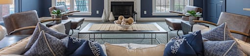 a living room with blue walls and a white fireplace