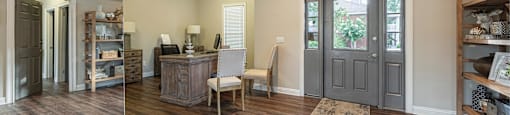 a remodeled living room with a wood floor and a gray door