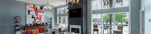 a living room with a couch and a table and a fireplace