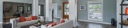 a living room with blue walls and a white couch