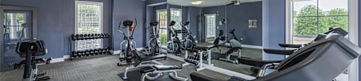 the gym at the enclave at deerwood apartments