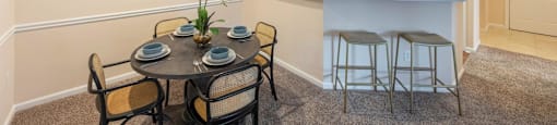 a dining room with a table and chairs and a kitchen