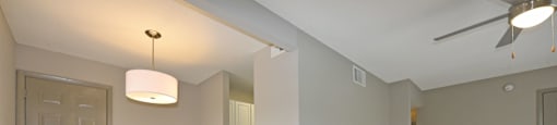 a bedroom with hardwood flooring and a ceiling fan