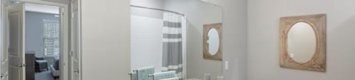 a bathroom with two sinks and a mirror