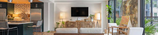 a living room and dining room with a couch and a table