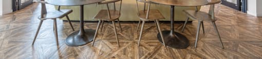a dining room with a table and chairs