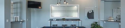 a dining room with a table and a chandelier