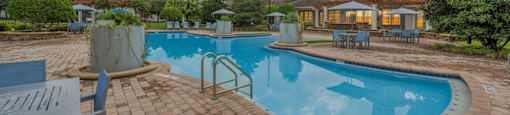 a swimming pool with a building in the background