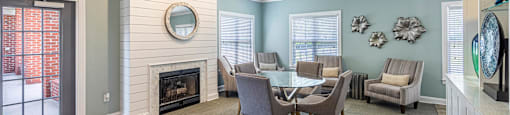 a dining room with a table and chairs and a fireplace