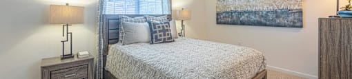 a bedroom with a bed and a ceiling fan