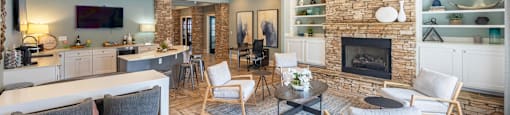 a living room with a fireplace and a table and chairs