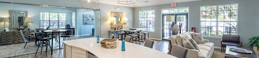 a large living room with a kitchen and a dining room