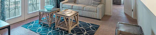 a living room with a couch and a table