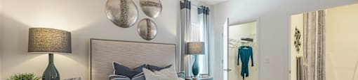 our apartments offer a bedroom with a large bed and a walk in closet