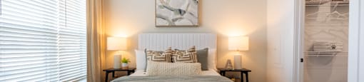 Altitude Raleigh Apartment Bedroom with a large walk-in closet and large window