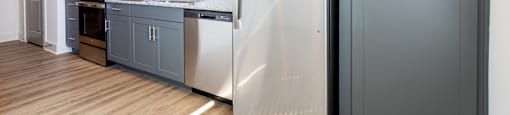 Altitude Raleigh kitchen with granite countertops and stainless steel appliances