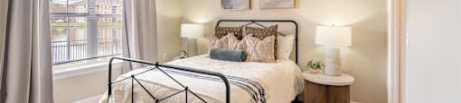 a bedroom with a large bed and a ceiling fan