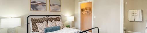 a bedroom with a large bed and a ceiling fan