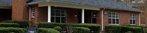 A brick clubhouse at Amelia Village apartments in Clayton, NC.