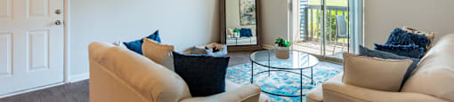 a living room with two couches and a coffee table