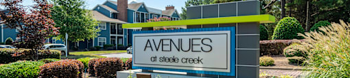 an image of the avenue of sleepy creek sign in front of the building