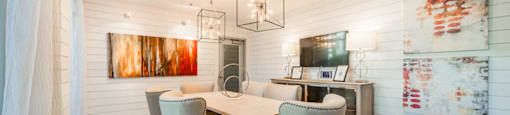 a dining room with a table and chairs