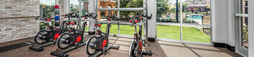 the residence apartments fitness center with exercise bikes