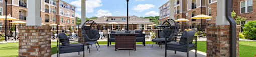 a rendering of a covered patio with a table and chairs