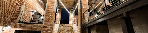 A staircase with lights on the side of it.