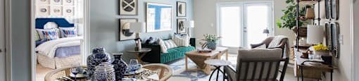 A dining room with a round table and chairs.