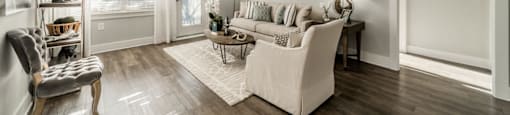 a living room with a couch and a chair