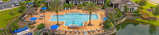 an aerial view of the resort with an outdoor swimming pool