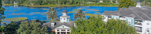 a view of the resort with the lake in the background