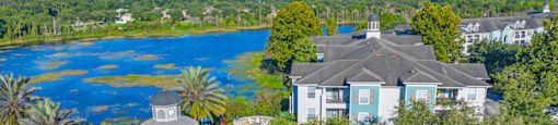 a aerial view of the resort with the lake in the background