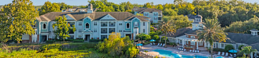 an aerial view of the resort with a swimming pool