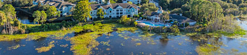 a view from above of a lake with houses on it