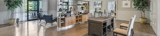 a large living room with exposed beams and a dining room table