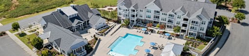 an aerial view of a large house with a swimming pool