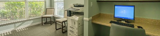 A room with a desk and a computer monitor.