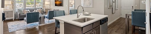 the preserve at ballantyne commons living room and kitchen with island and dining area