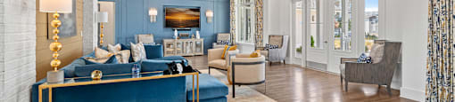 a living room with blue walls and a wood floor