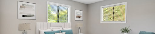 a bedroom with a bed and a chair in a 555 waverly unit
