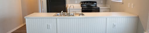 Beautiful kitchen in Deerbrook Apartment homes with spacious countertops and overhead lighting