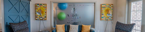 Relax with friends and family inside the clubhouse at Millis and Main at Grandover