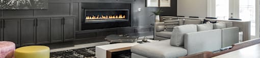 a living room with a couch and a table and a fireplace