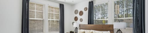 a bedroom with a bed and a ceiling fan