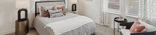 a bedroom with a bed and three windows