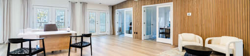 A modern living room with wooden floors and furniture.
