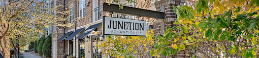 A street view of a sign that says